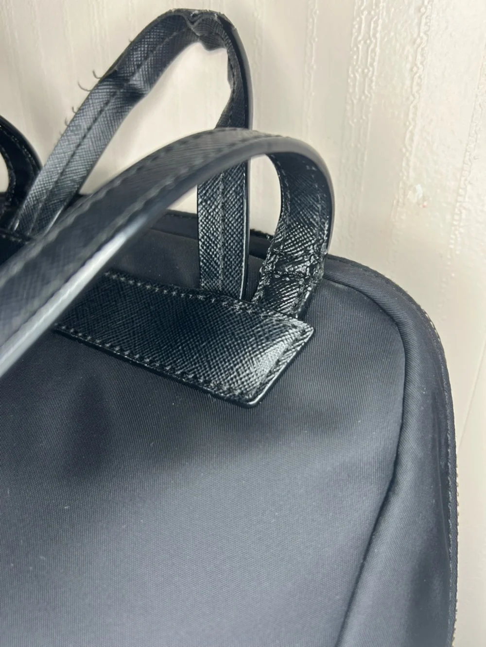 Kate Spade Blake Ave black nylon mini backpack with gold hardware